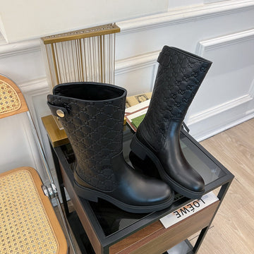GG EMBOSSED LEATHER ANKLE BOOTS IN BLACK CALFSKIN