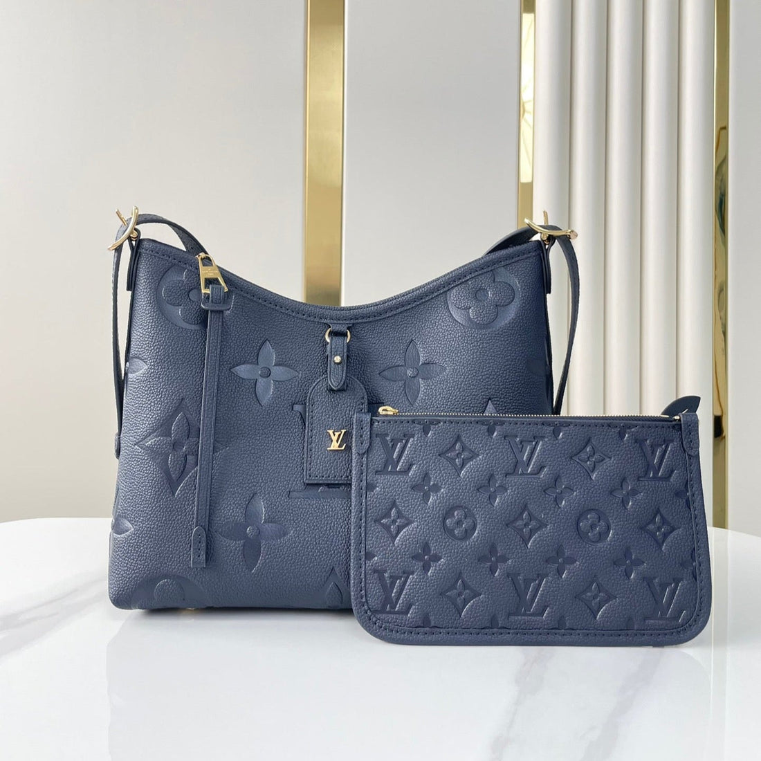 CARRYALL 29 IN DARK NAVY MONOGRAM EMPREINTE LEATHER