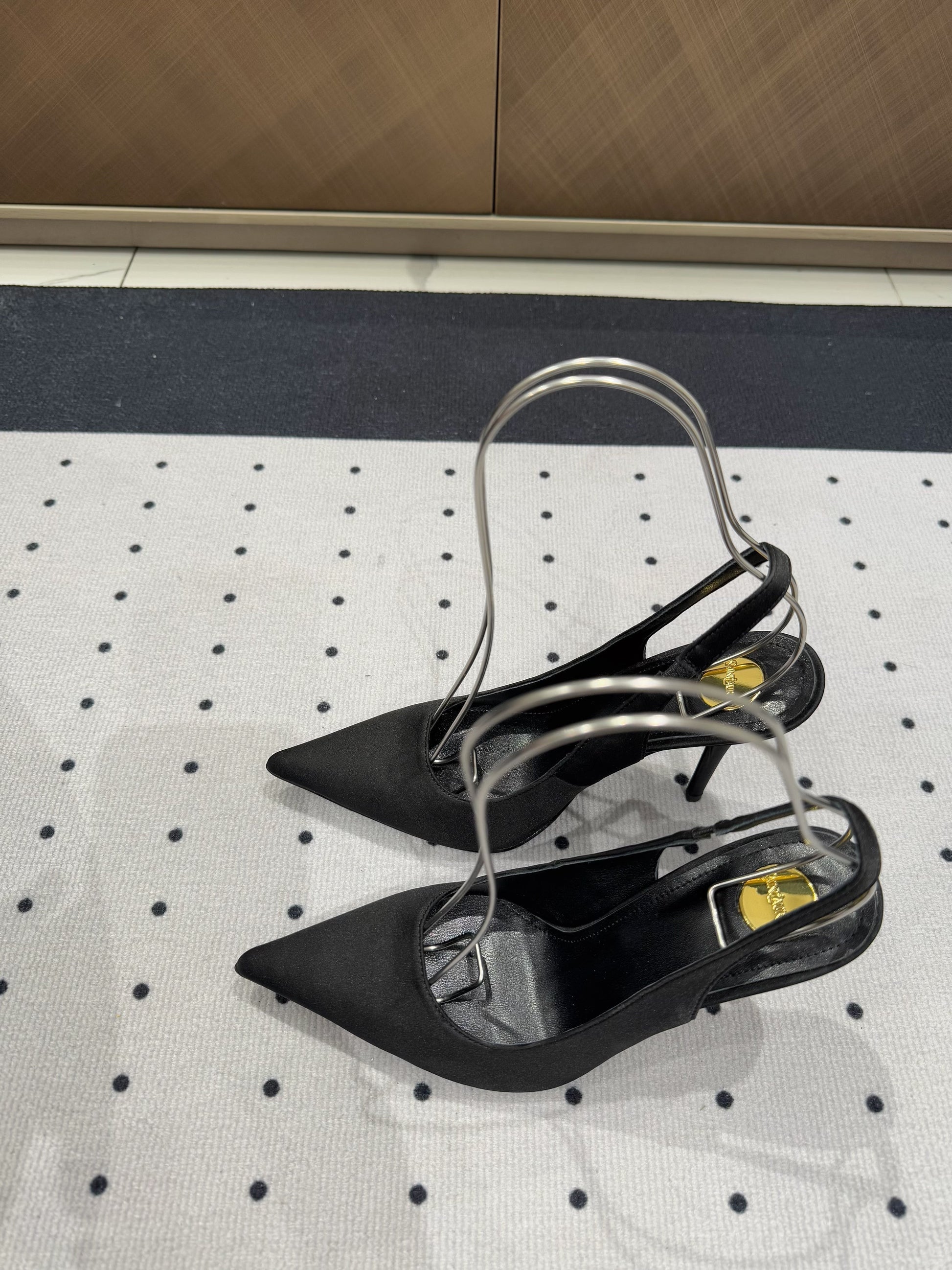 L'ENTRACTE SLINGBACK PUMPS IN BLACK SATIN