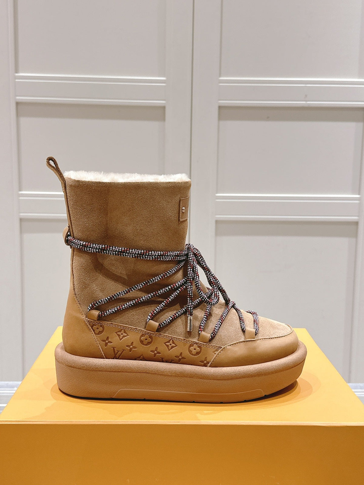 ASPEN PLATFORM ANKLE BOOT IN CIDER BROWN MONOGRAM DEBOSSED SUEDE AND SHEARLING