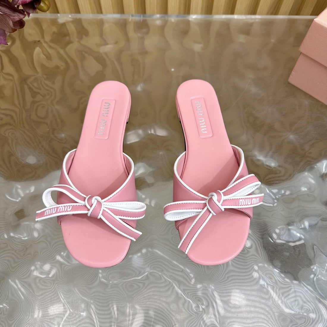 SLIDES SANDALS IN PINK CALFSKIN WITH BOW IN TRAP