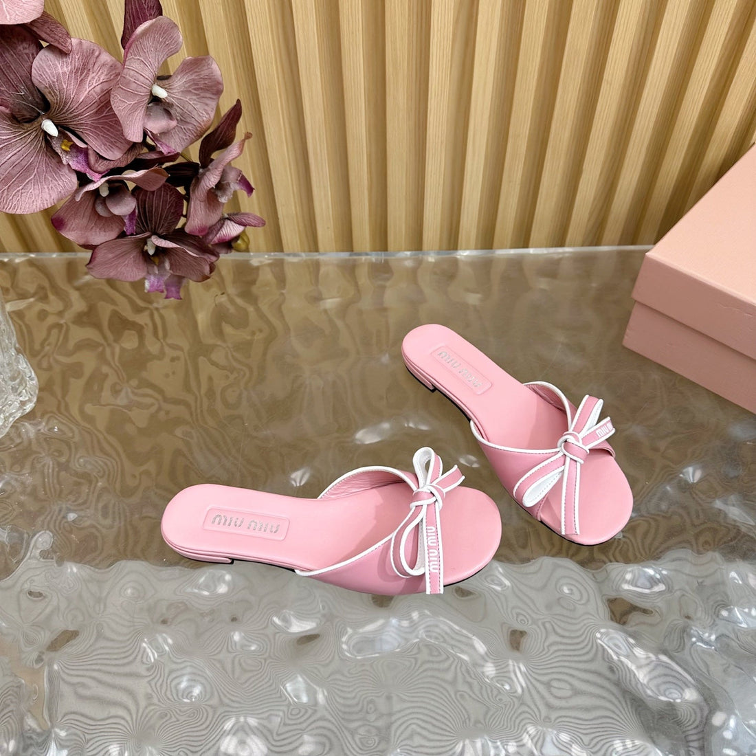 SLIDES SANDALS IN PINK CALFSKIN WITH BOW IN TRAP