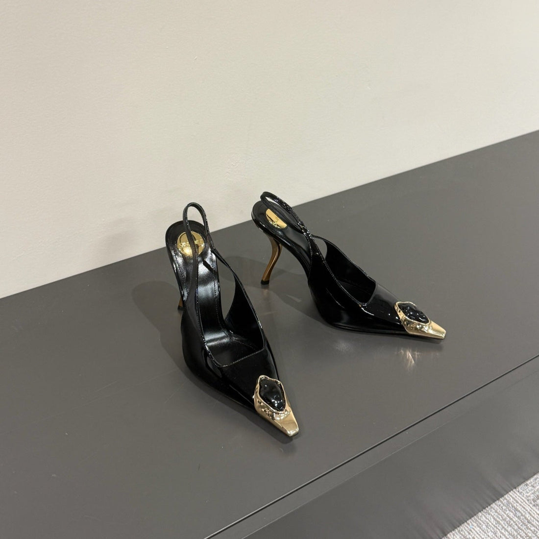 BLACK GEM-STUDDED SLINGBACK PUMPS IN BLACK PATENT CALFSKIN